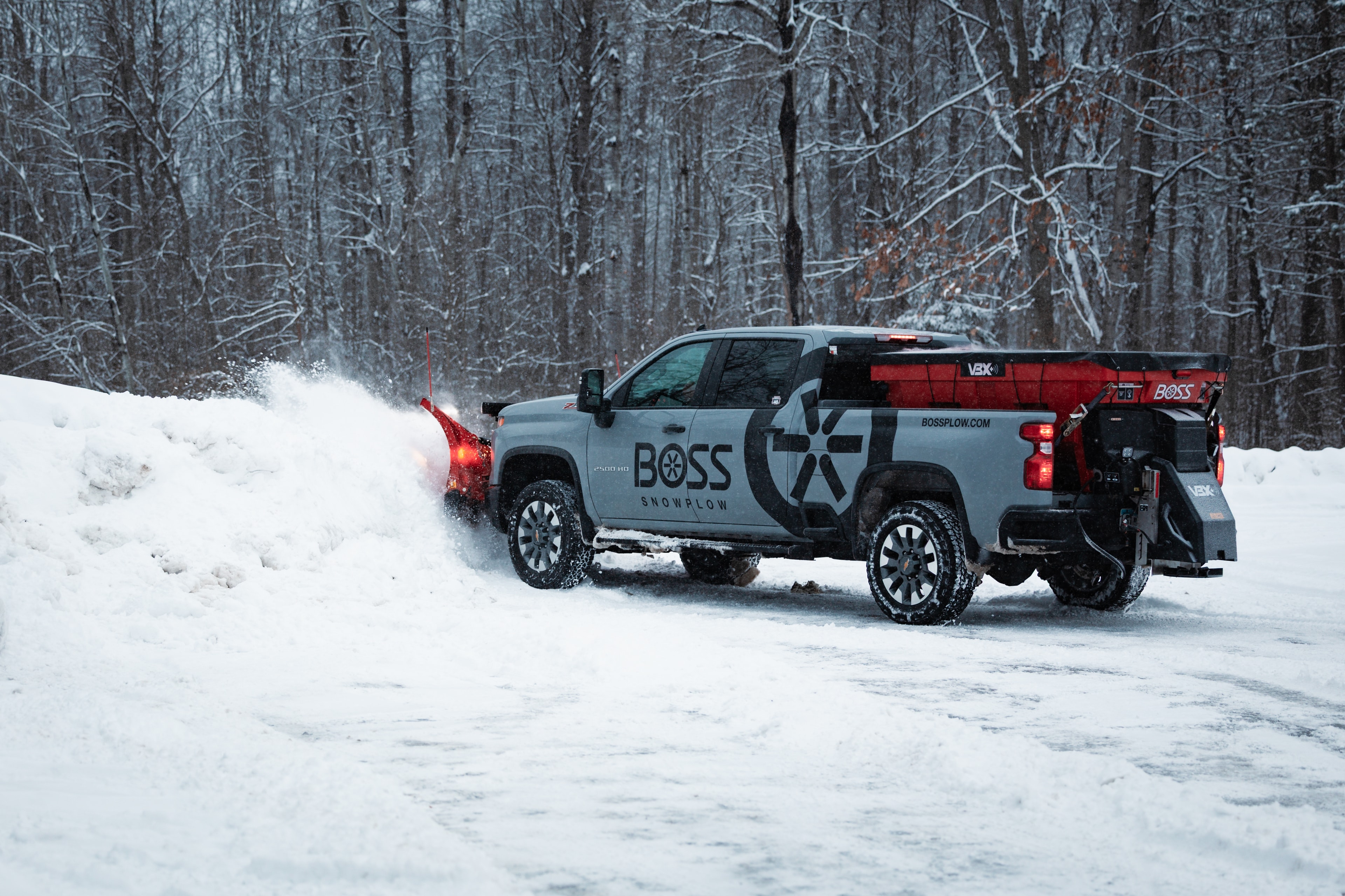 BOSS VBX+ hopper spreader on truck — 6'5", 8', and 9' models